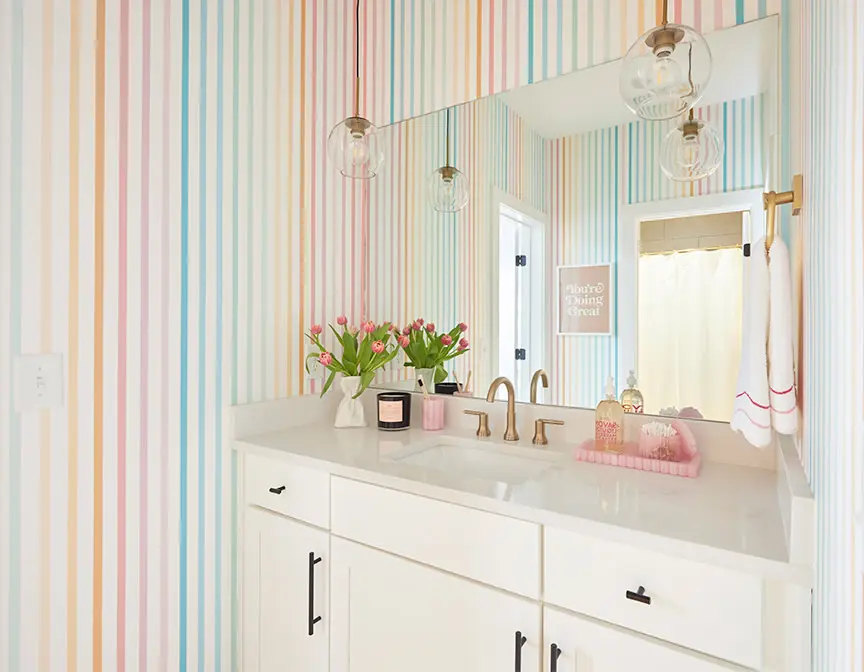 Rainbow striped wallpaper in a bathroom.