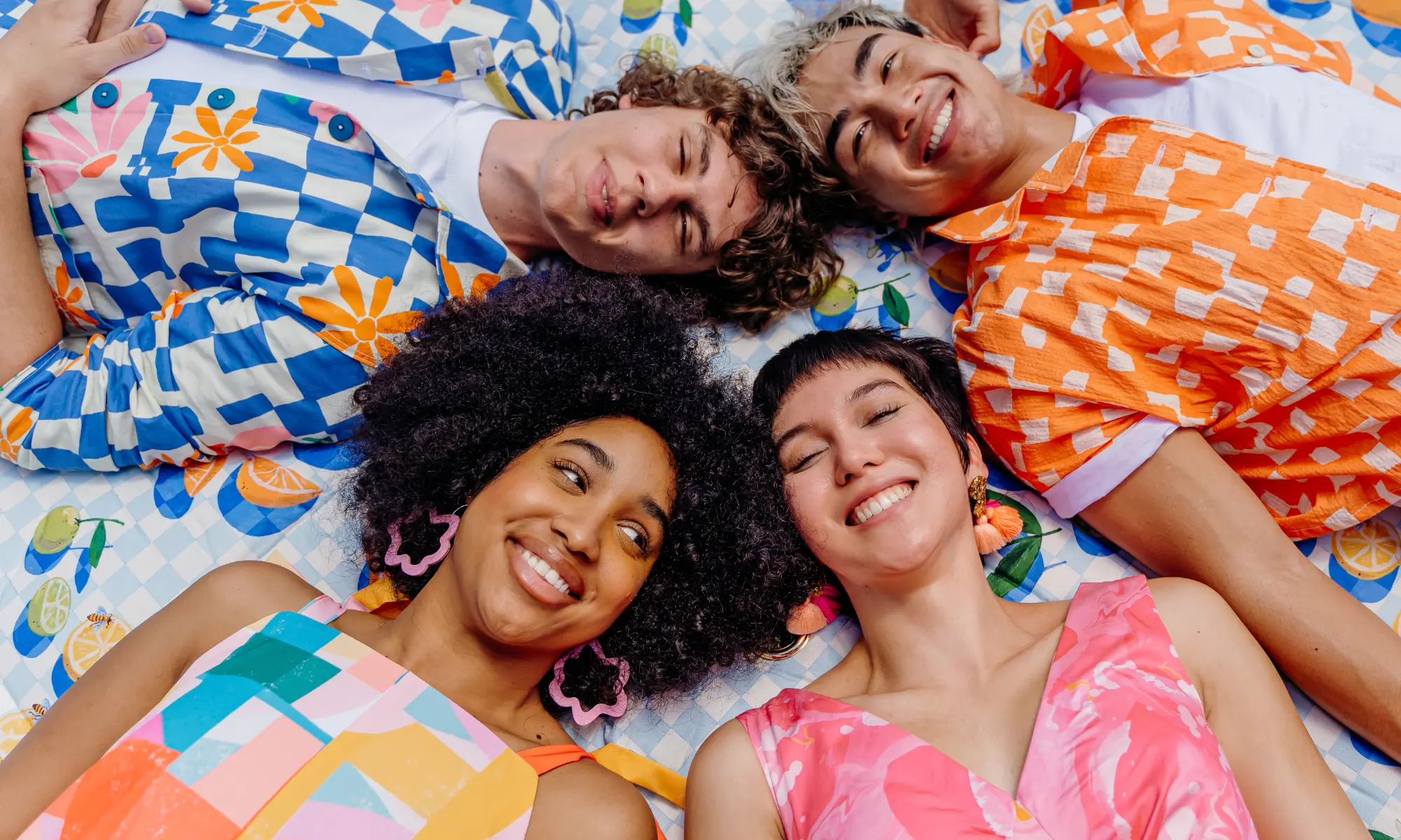 Smiling people in colorful summer clothing