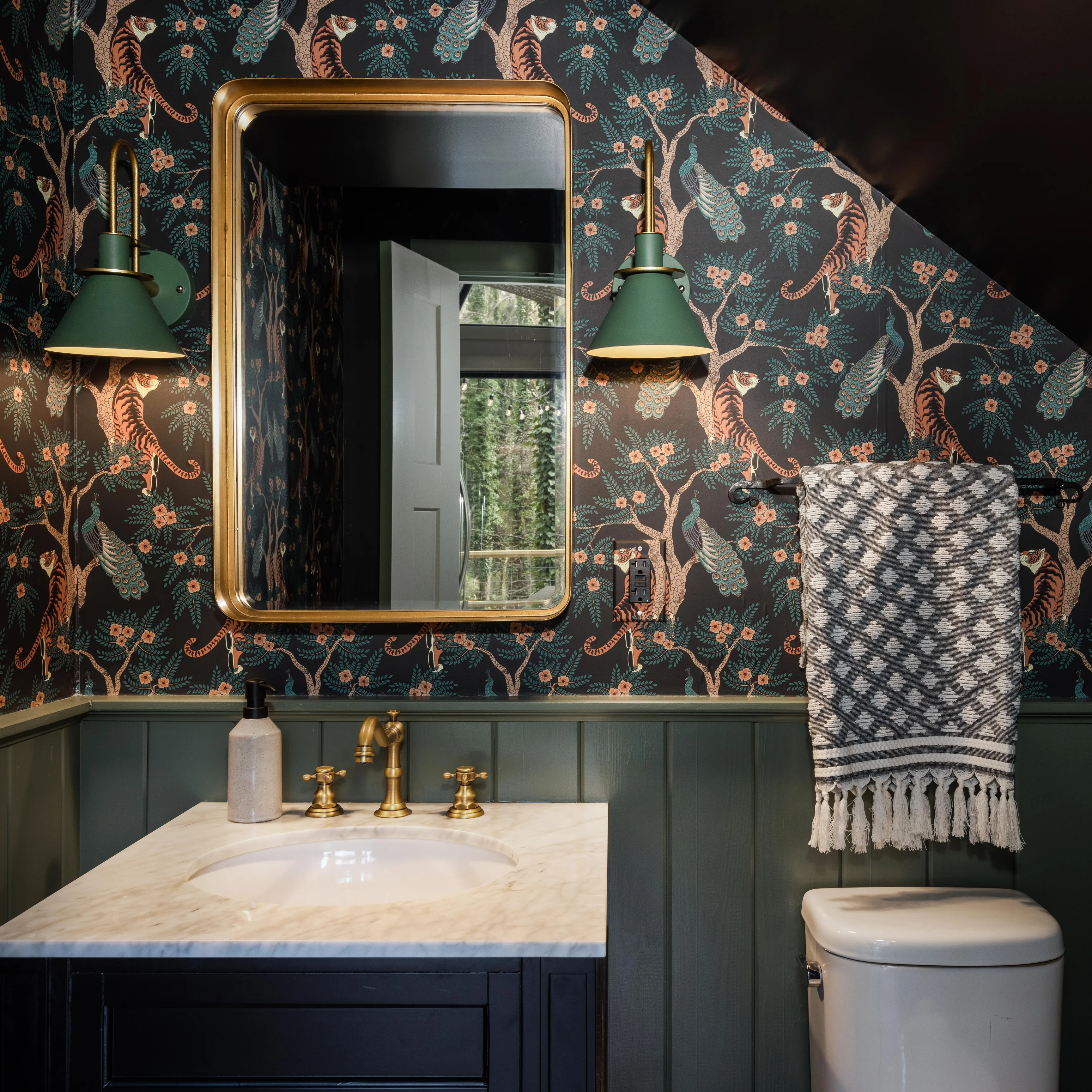 Small bathroom with tiger print wallpaper