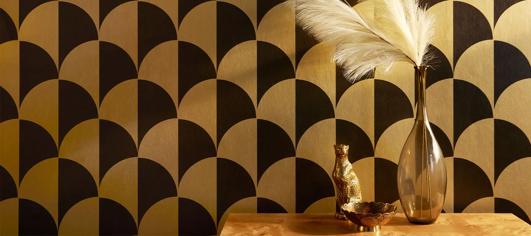 Art deco style black and gold metallic wallpaper.